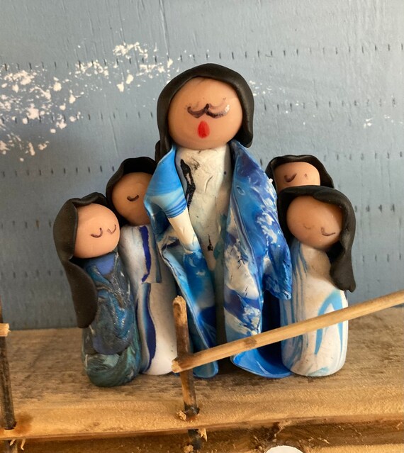 Storyteller in Polymer Clay in Blue and Whits