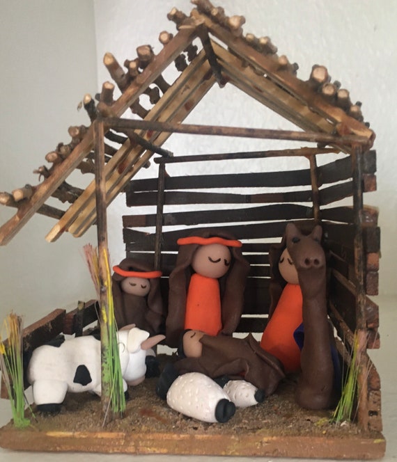 Nativity Clay Figures in Wooden Stable