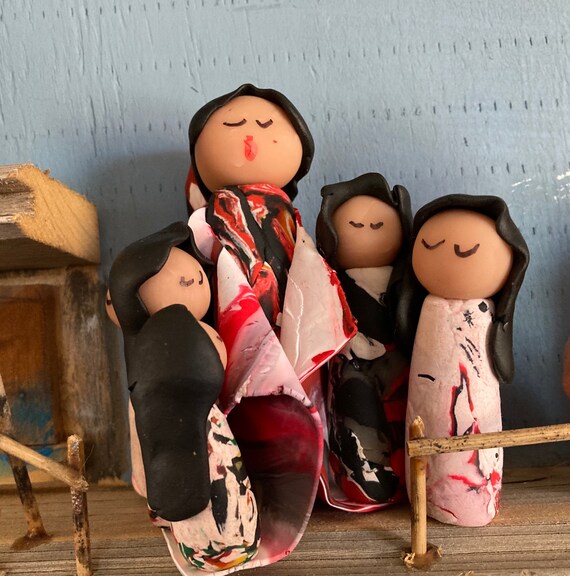 Storyteller in Polymer Clay in Red, Black and White