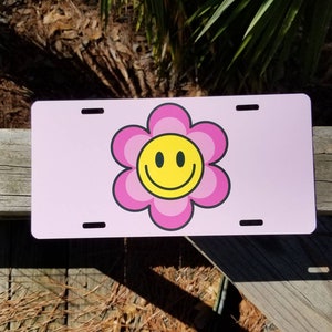 Aesthetic Hippie Retro Smiley Flower Face license plate. Pink and yellow smiley. Happy. Front license plate car tag. Name plate, Vanity