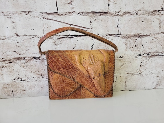 Crocodile purse hotsell with head