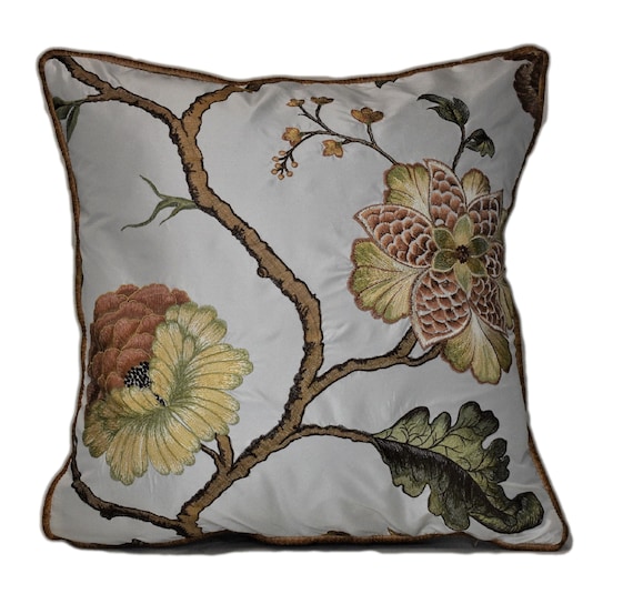 gold embroidered floral decorative throw pillow on white silk like taffetta