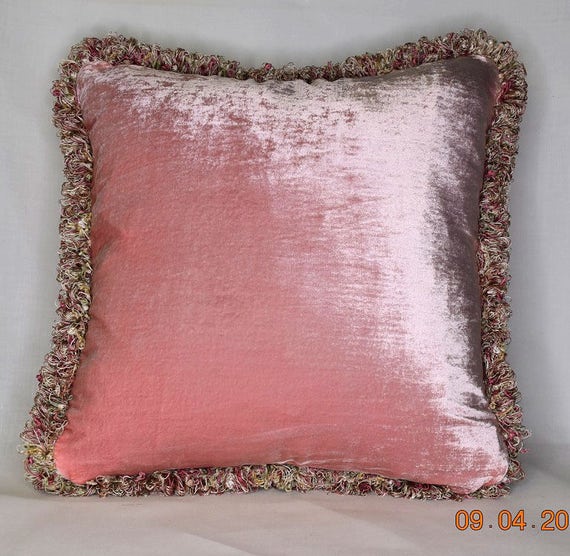 large pink silk velvet throw pillow with fringe for sofa or