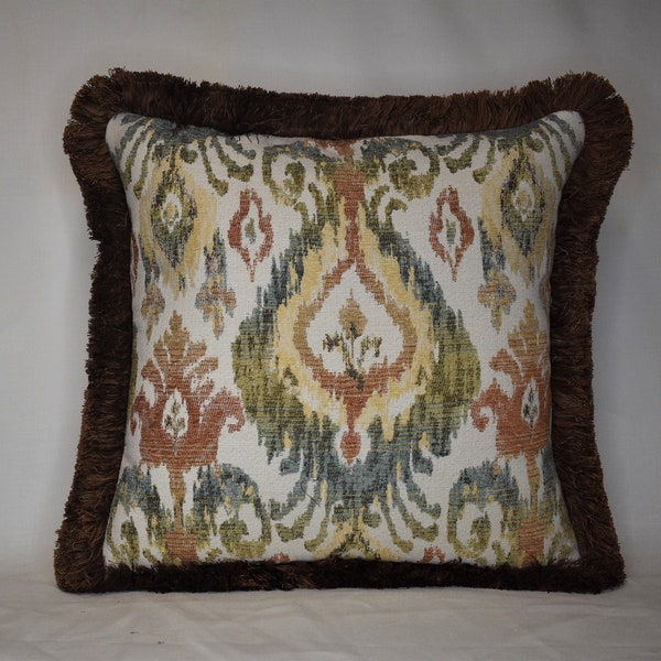 burnt orange rust or green ikat heavy woven decorative throw pillow in green rust and yellow on off white.