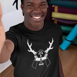 May include: A black t-shirt with a white graphic of a samurai helmet with antlers. The text "LOVE BOND" is visible at the bottom of the shirt.