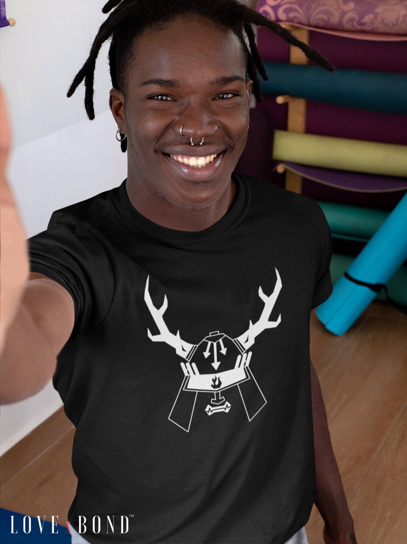 May include: A black t-shirt with a white graphic of a samurai helmet with antlers. The text "LOVE BOND" is visible at the bottom of the shirt.