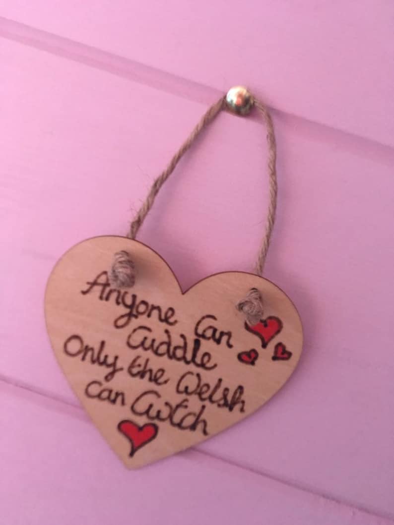 Anyone can cuddle only the welsh can Cwtch with hearts wooden hanging hearts