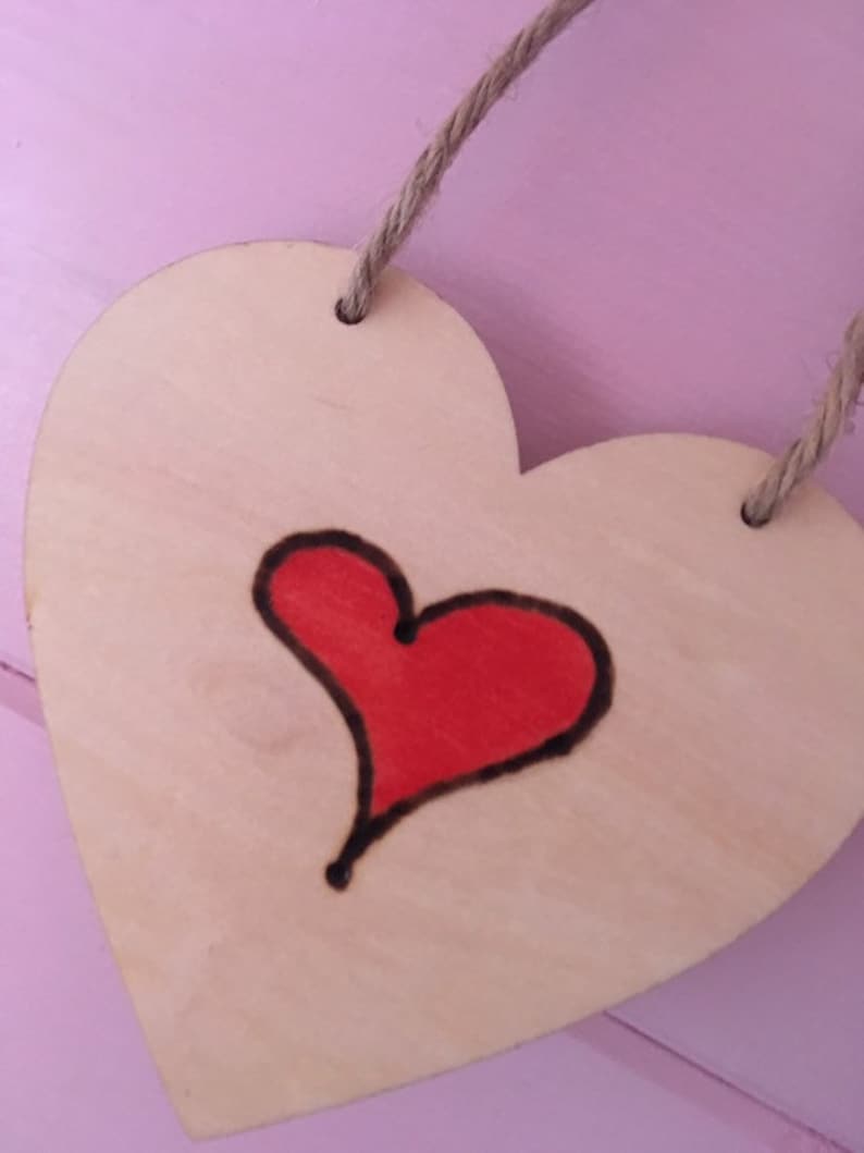 Anyone can cuddle only the welsh can Cwtch with hearts wooden hanging hearts