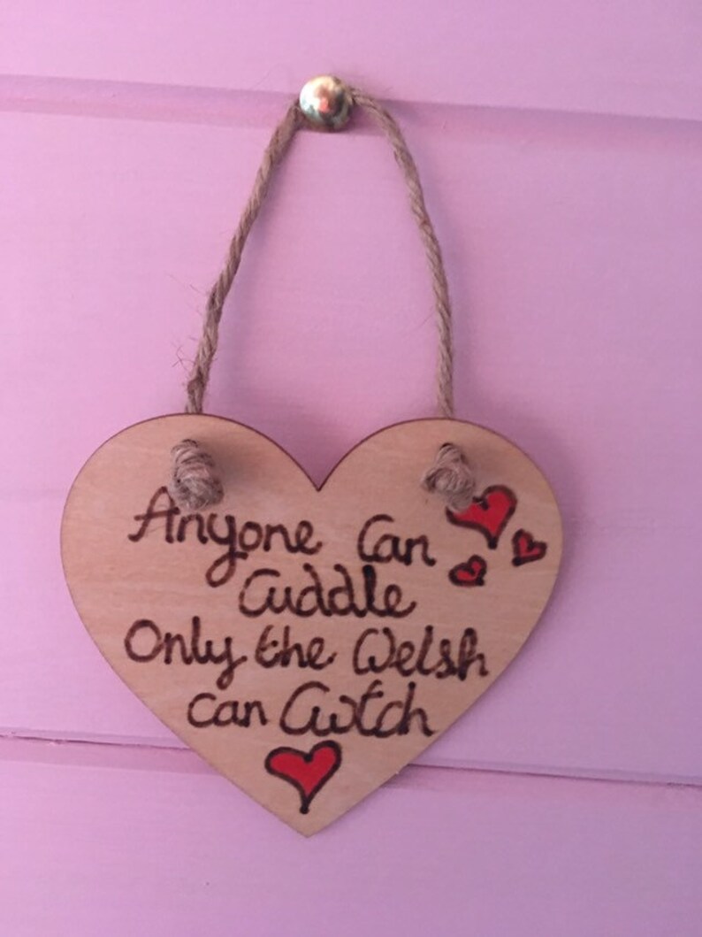 Anyone can cuddle only the welsh can Cwtch with hearts wooden hanging hearts