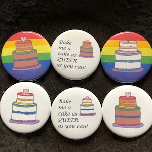 May include: Six circular badges featuring cake illustrations and the phrase "Bake me a cake as QUEER as you can!". The cakes are rainbow-layered with heart toppers, some against a rainbow backdrop.