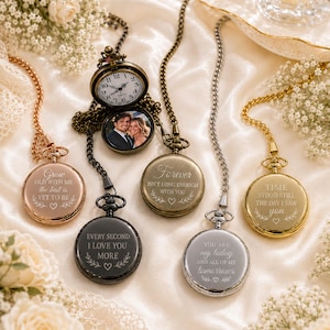 May include: Five pocket watches with chains in rose gold, black, bronze, silver, and gold finishes. Each watch features engraved text, including phrases like Grow old with me, Forever, and You are my today. One watch is open, showing a clock face and a photo.