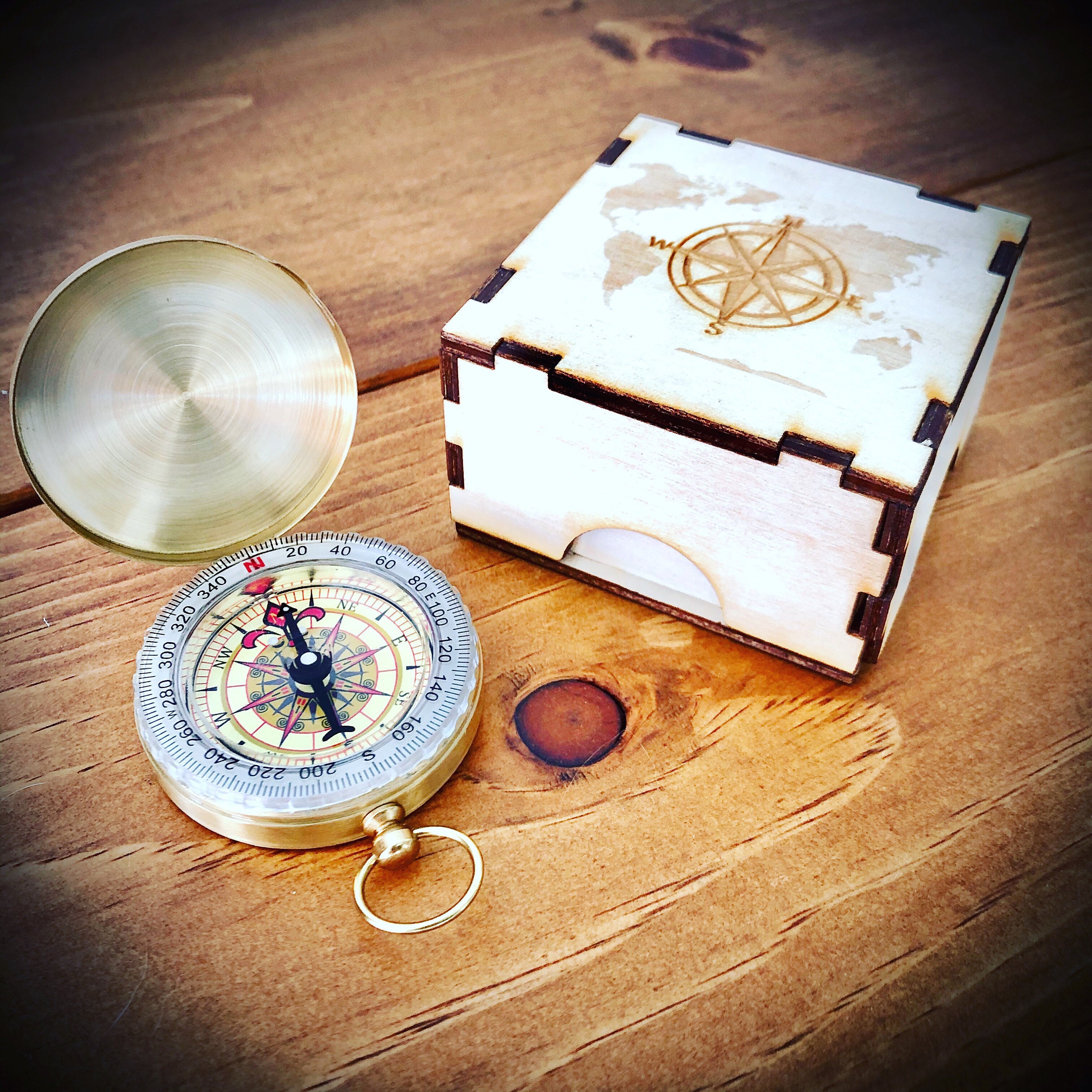 Brass compass, handcrafted, in a free wooden box.