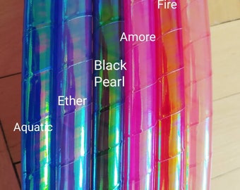 May include: Four iridescent hoop dance hoops in different colours. From left to right: Aquatic, Ether, Black Pearl, Amore, Fire, and Pixie Dust.