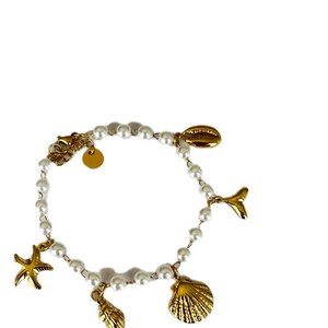 May include: A gold charm bracelet with white pearls and various sea-themed charms, including a starfish, seashells, and a dolphin tail.