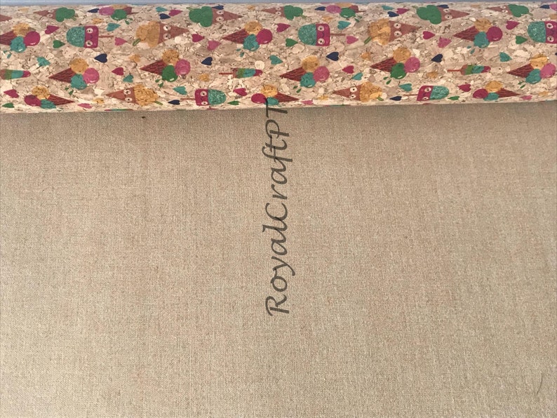 May include: A close-up of a cork fabric roll with a colorful ice cream cone pattern. The fabric is rolled up and the text "RoyalCraftPT" is written vertically on the side.