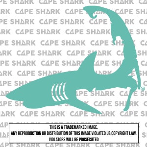 May include: A teal-colored shark silhouette with the outline of Cape Cod. The background features a repeating pattern of the words "CAPE SHARK". The image includes a copyright notice at the bottom.