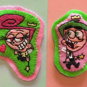 Met de hand gemaakte vilten patches van Cosmo en Wanda erop naaien - cartoon redelijk eigenaardige ouders handborduurwerk