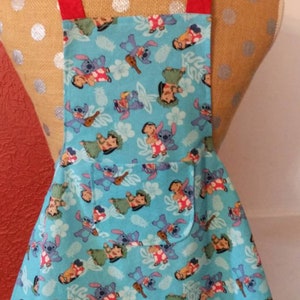GIRLS Apron LILO & STITCH   --  ages 3-7  -  one lined pocket in center of flared skirt, red ties at waist and neck
