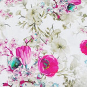 May include: A white fabric featuring a dense floral pattern with vibrant magenta and pink blossoms, interspersed with muted grey-green leaves and stems. The design includes various flower shapes, including rounded petals and buds, across the surface.