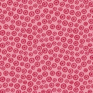 May include: A pink fabric with a repeating pattern of small, dark red floral designs. The flowers are composed of small dots and shapes, creating a textured appearance. The overall design is a dense, all-over pattern.