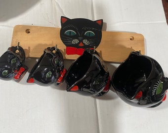 Rare 1950s Shafford red ware black cat measuring cups and rack