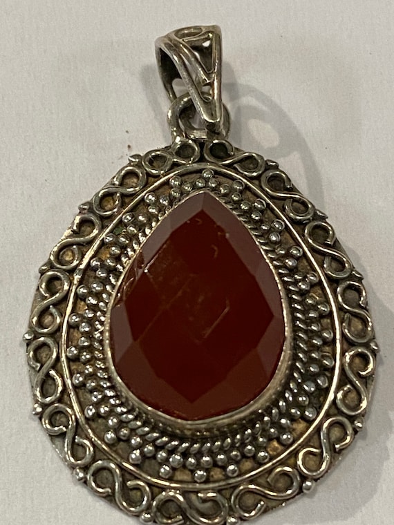 Sterling silver and faceted carnelian stone