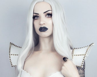 White gothic punk shoulder pads decorated with gold spikes
