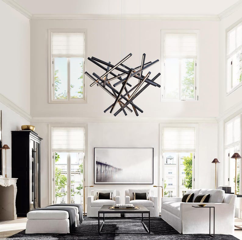 Large diamond-shaped wooden chandelier suspended in a modern dining room. Sculptural LED pendant light designed for high ceilings and spacious interiors