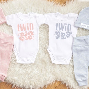 Cute Twin Baby Outfits. Heather Peach and Blue Twin Girl Boy Going