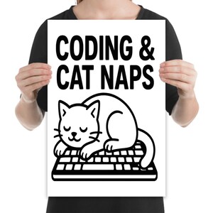 May include: A white poster with the text "CODING & CAT NAPS" in bold black letters. Below the text is a black and white illustration of a cat sleeping on a keyboard. The cat is white with black outlines and closed eyes.