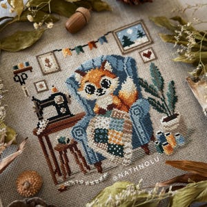 Warm cozy sewing scene with a fox quilting surrounded by soft patchwork elements.
