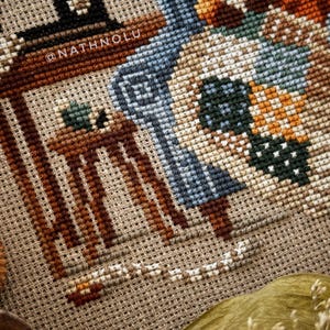 Detailed view of the patchwork quilt design with stitched fabric squares in various colors and patterns.