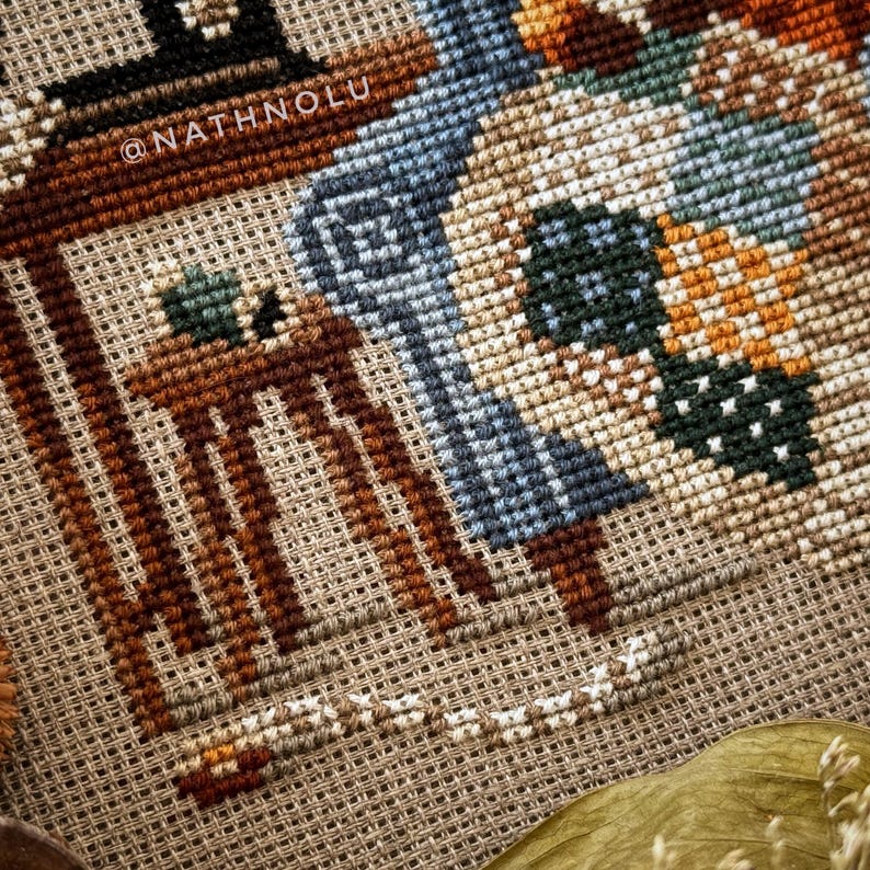 Detailed view of the patchwork quilt design with stitched fabric squares in various colors and patterns.