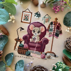 Whimsical mice embroidery design with crochet hooks, yarn balls, and colorful granny square sweater