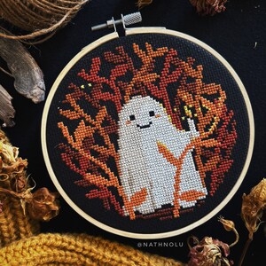 Bring the spirit of Halloween to life with this ghost watcher embroidery design