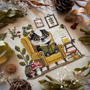 Whimsical woodland animal pattern showing a reading badger in a warm, rustic reading nook and a small frog companion.