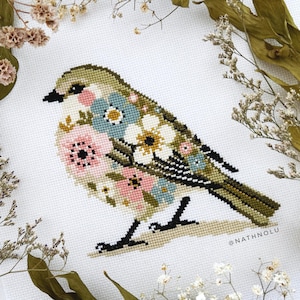 Floral songbird embroidery design featuring a cute blooming birdie, ideal for spring cross stitch projects