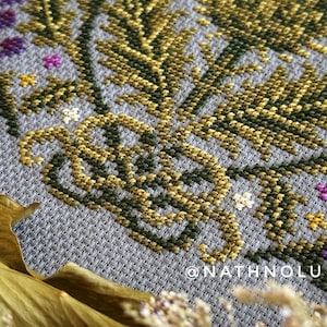 Nature cross stitch pattern of a floral garden meadow with a bee, perfect for botanical decor and handmade gifts