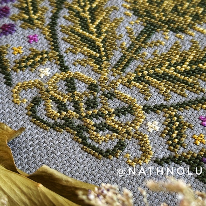 Nature cross stitch pattern of a floral garden meadow with a bee, perfect for botanical decor and handmade gifts
