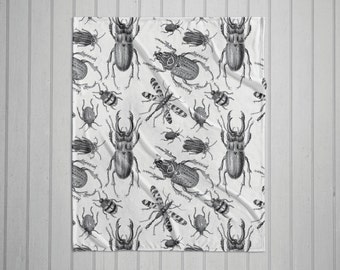Black and white vintage bugs plush throw blanket with white back