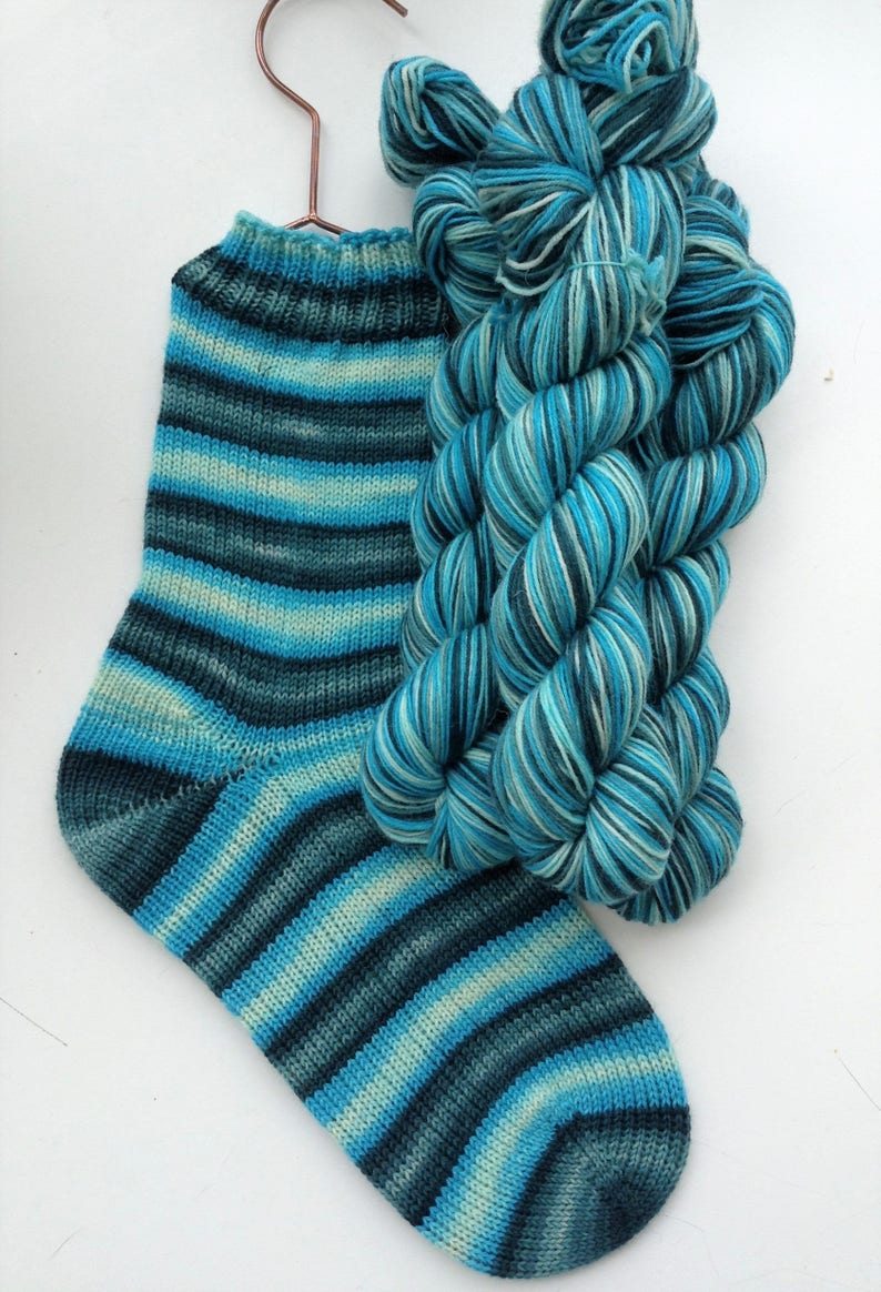 Hand dyed self striping sock yarn Frostbite