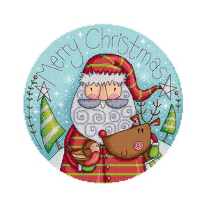 May include: A round, blue and white Christmas ornament with a cartoon Santa Claus holding a reindeer and a bird. The ornament says "Merry Christmas" in a red script font.