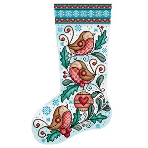 May include: A blue and white Christmas stocking with a red and white ornament and three brown birds with red accents on a green leafy branch.