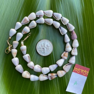 May include: A rustic wooden sign with the text "Welcome to our home" in white lettering. The sign features a distressed finish and a simple, inviting design, perfect for entryway decor.