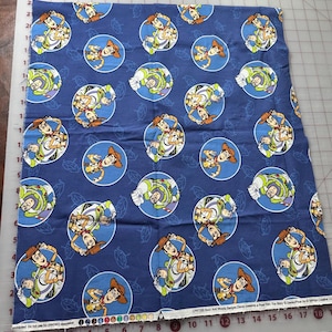Buzz & Woody Badges Toy Story friend vinta Blue Disney Spring creative blue brown Fabric OOP rare Pixar Quilting cotton. 19”x43” Estate #764