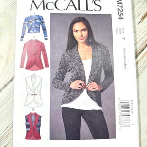 May include: McCall's M7254 sewing pattern. The pattern features illustrations of various jacket and vest designs. The cover shows a woman wearing a black and white speckled jacket. The pattern is designed and printed in the USA.
