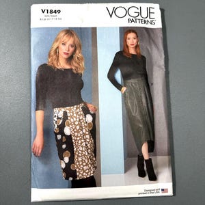 May include: Vogue Patterns sewing pattern V1849. The pattern features two women modeling the designs. The cover includes the text "VOGUE PATTERNS" and "V1849". The size range is BS (8-10-12-14-16). The pattern is designed and printed in the USA.