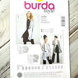 May include: A Burda Style sewing pattern for a jacket, featuring a photo of a woman wearing the jacket. The pattern includes sizes 10-20 and is printed on white paper. The pattern's title is in multiple languages.