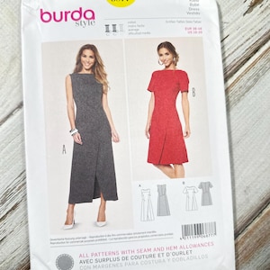 Puede incluir: Un patrón de costura Burda Style para vestidos, con dos diseños de vestidos. El paquete es blanco con el número 6877 en un círculo amarillo. La parte delantera muestra ilustraciones de los vestidos, con texto en varios idiomas.