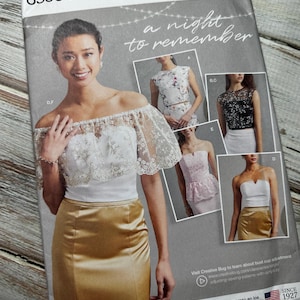 Peut inclure: Patron de couture Simplicity numéro 8598 BB pour une soirée inoubliable. Le patron comprend quatre styles différents de hauts et de jupes pour les tailles femmes 18W-26W. Le patron est conçu et imprimé aux États-Unis.